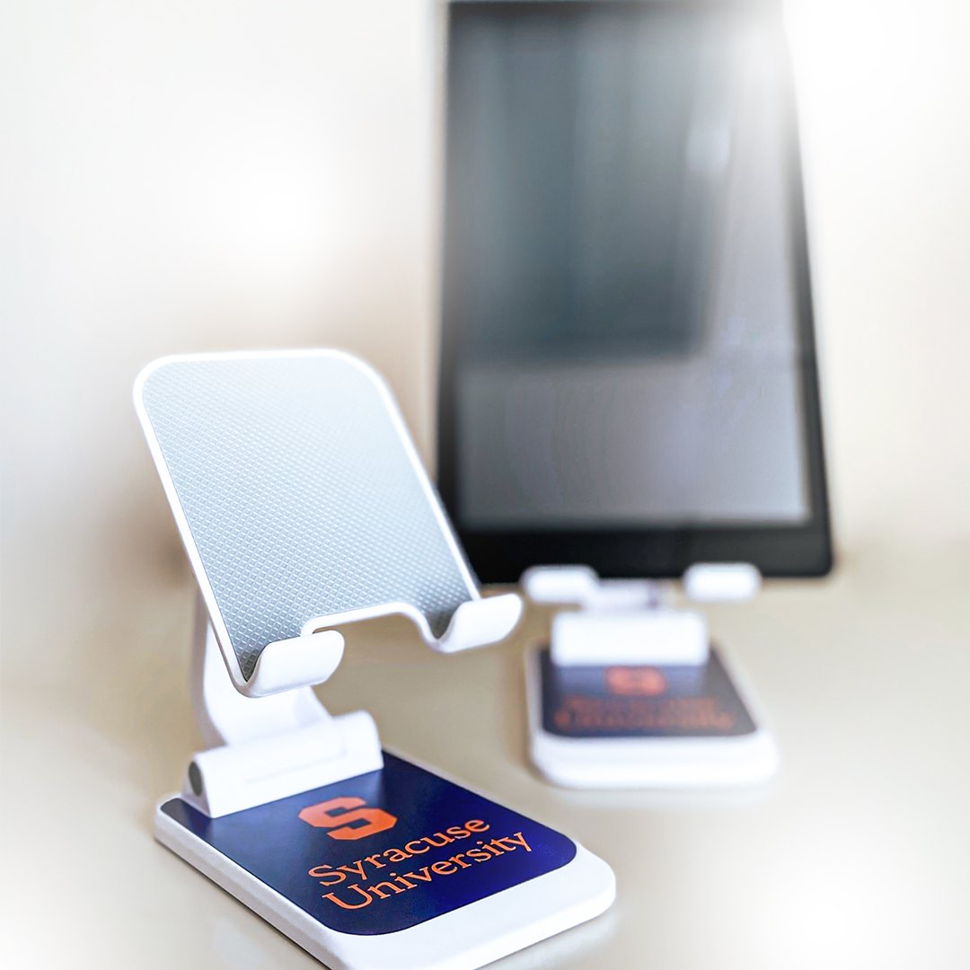 SUProStudies's tweet photo. In need of some new Syracuse University swag for your home or office? Want to support students? Look no further!

Give $25 or more to support part-time scholarships, and receive an SU phone/tablet stand: 

https://t.co/GMsg3eYM7i https://t.co/PRfai11UoA