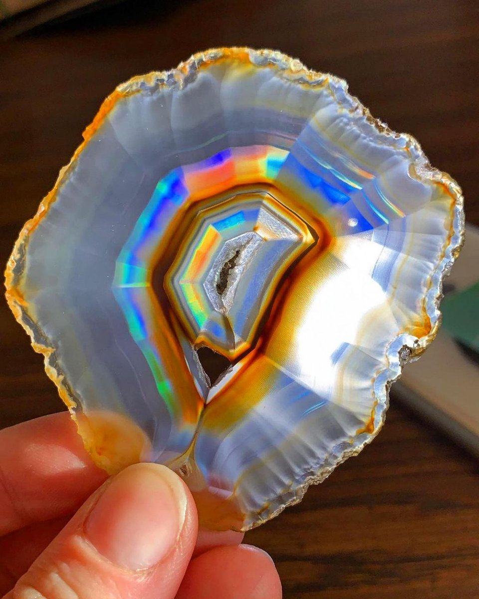 Natural rainbow Iris agate!

Iris Agate is a unique type of thinly sliced Agate that exhibits a rainbow effect when held up to the sun or a light   

Photo: PsychedelicRock/etsy