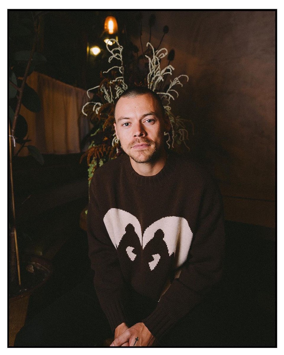 Harry Styles for Pleasing, wearing the new 'kissing swan' sweater which will be available alongside more new pieces soon.