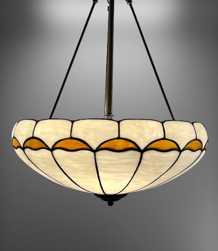 A must-see Leaded Glass Inverted Dome, Circa 1910,  a true masterpiece of antique lighting. 
The intricate design features an enchanting wave pattern in amber, set against a striking white background. genuineantiquelighting.net/pc/JI1/3369d/G…