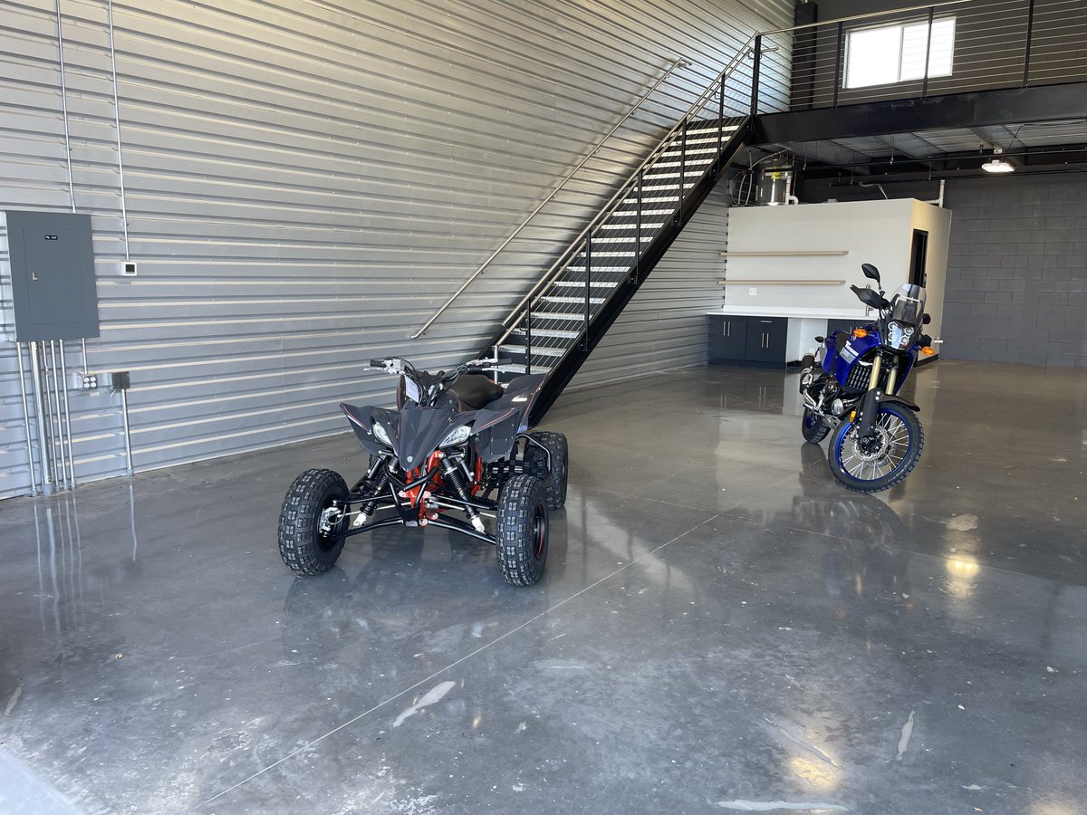 development_pw's tweet photo. 🎉 Shoutout to Rick Baker and Sheri Fritz for rocking the Fort Collins Elite Garage Gala last week!  With the help of Tri-City Motorsport, they filled our units with motorcycles, ATVs, and even a Bentley. Cheers to our amazing broker team for making it a fantastic day! 🏍️🥳 https://t.co/7HdfWPm4Lk