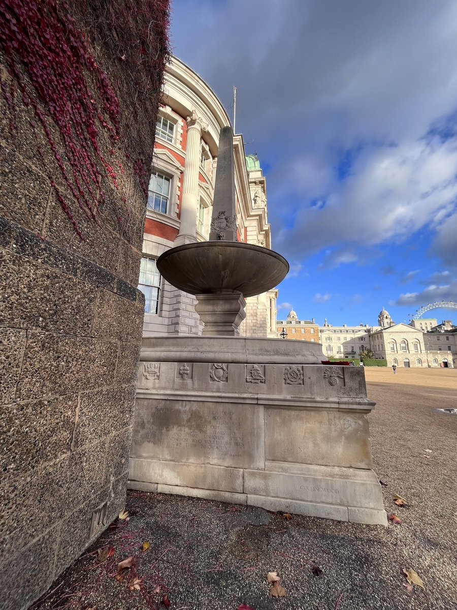 The RND memorial at Horse Guards Parade, a Portland Stone obelisk and dish, sitting above a stone base with regimental badges