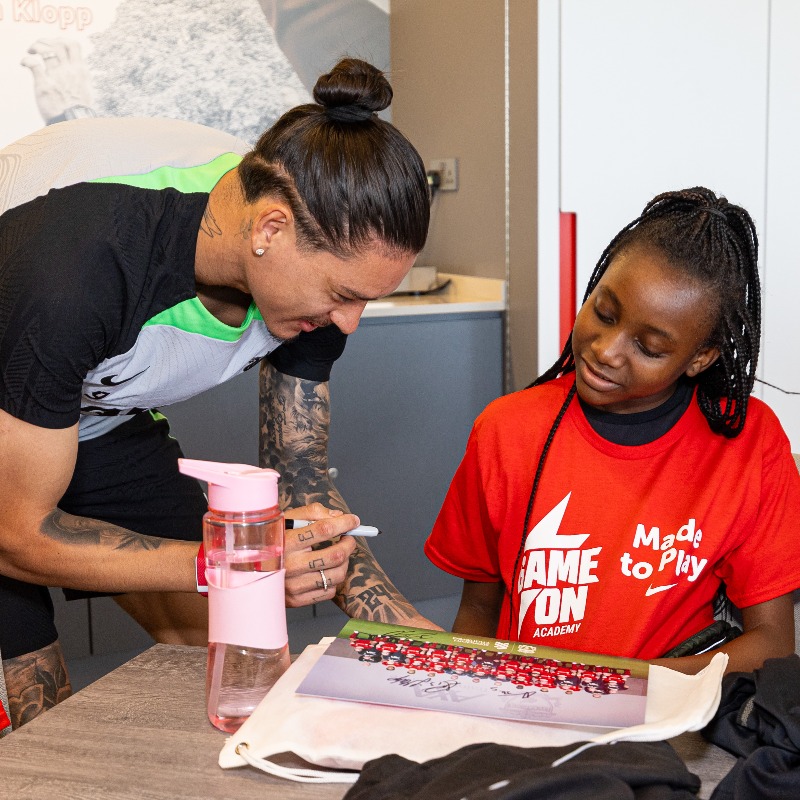 LFC's tweet photo. A group of local school children were given a day to remember at the AXA Training Centre recently when they were surprised by their heroes during a @nikefootball #GAMEON event hosted by @LFCFoundation. 💫