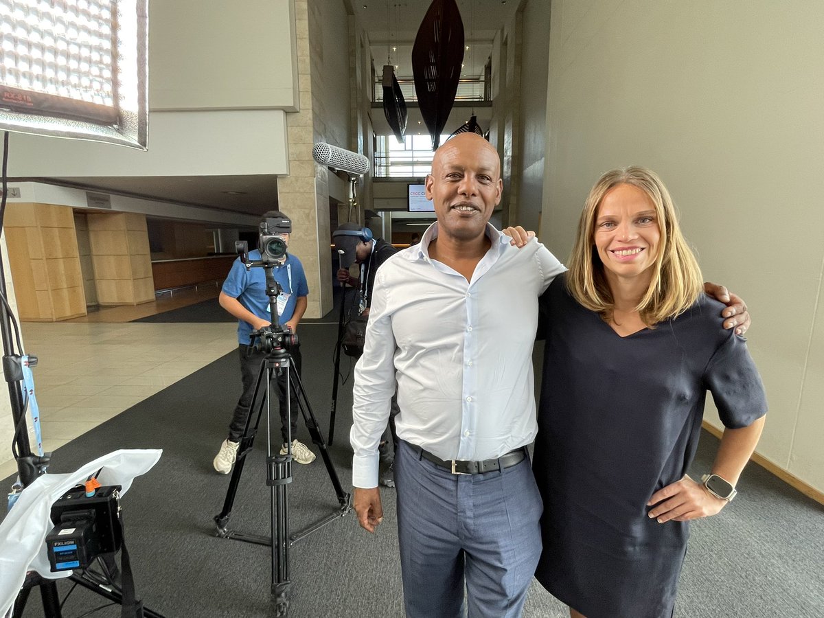 Finnfund's tweet photo. Greetings from #AfricaTechFestival in Capetown. The event is full of happy encounters with #finnfund investee companies, here #bcs Yonas Maru and @JRaehalme. BCS’s network provides capacity to landlocked countries across Africa. #investing #impact https://t.co/53H46D8YGw