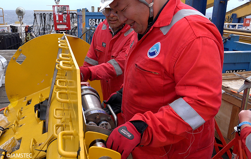 Chikyu_JAMSTEC's tweet photo. Final sensor check in progress. #Porewater pressure sensors attached to the yellow #CORKhead. Seafloor reference &amp; borehole pressure sensors for calibrating &amp; removing seafloor water pressure fluctuations to capture the faint #slowslip signal from downhole porewater pressure. https://t.co/QEGcLsvcWB