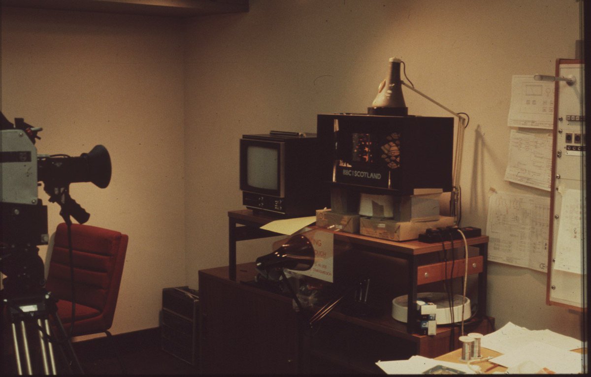 MauraCurrie's tweet photo. BBC Christmas idents are part of the magic and in a few weeks they’ll be on our screens again. Here’s how it worked on BBC 1 Scotland in ‘82 - camera pointing to a box with mirrors, turntable and an anglepoise lamp (2 spare bulbs on shelf!)  #announcer  #voiceover #bbcidents #bbc https://t.co/2gtyknoTwQ