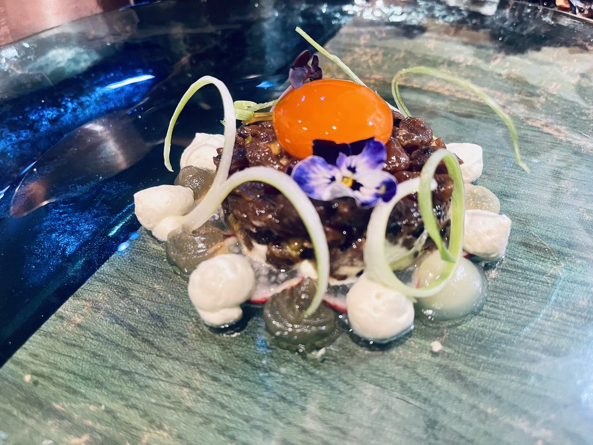 Teriyaki beef tartare, soy cured egg yolk, wasabi cream, mirin gel, pickled mooli, spring onion