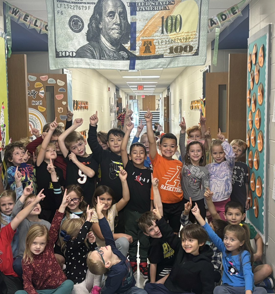 McGheeJennifer's tweet photo. As you can see in this picture, Summit’s 1st graders were beyond excited to host the Clash of the Quarters Flag today! Their smiles during our morning collections are contagious! @summitbees @SummitPTA @9UnitedLeaders https://t.co/bAgPZNNRtY