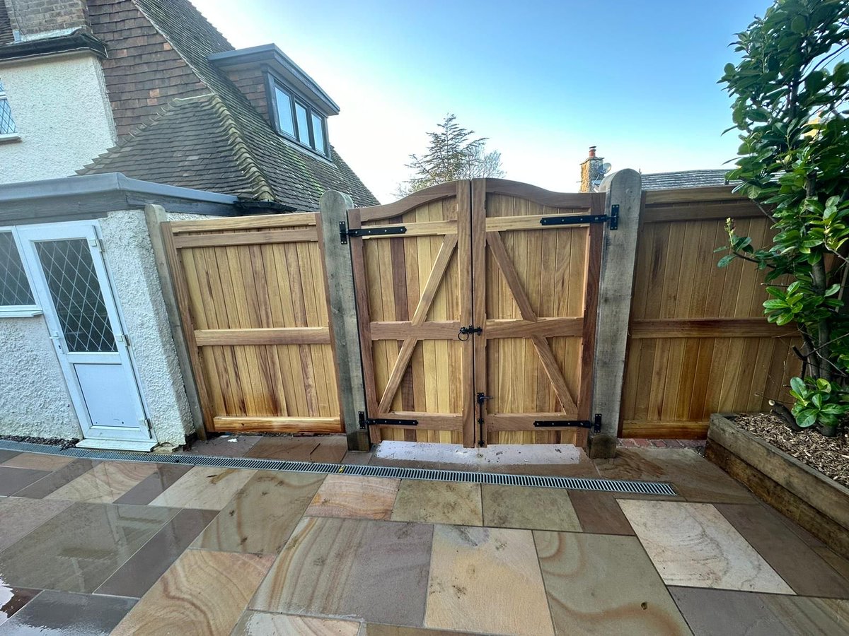 Another fine pair of bespoke iroko gates and panels for a very satisfied customer, just need a few dry days to stain the Oak post.  #Gates #Panels #Fencing #Iroko
