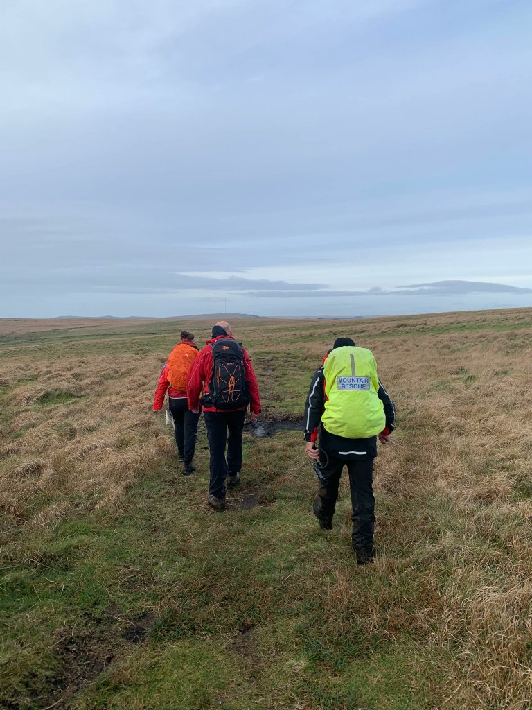 Team called yesterday to assist a cold and lost walker. We deployed from Peat Cot and located her &amp; dog near Broad Rock. We warmed her up with an extra jacket &amp; hot coffee before escorting her off the Moor, standing down the Police helicopter which had arrived to help. #Dartmoor
