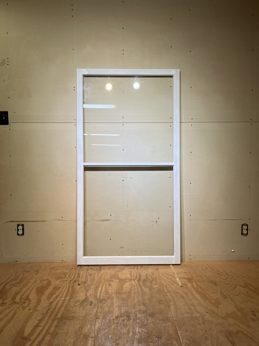 Traditional custom wood storm window sash.