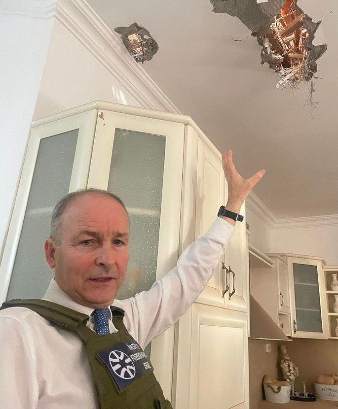 I initially thought/hoped this pic was doctored. It is disgusting that the tanaiste has debased himself and his country by acting as a prop in an Israeli propaganda photo shoot.