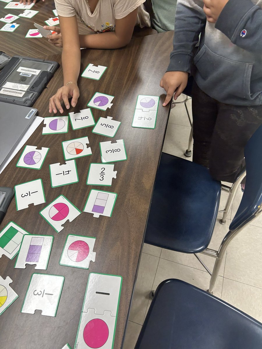 MrsAlgebrainiac's tweet photo. 🧩 Fun review day in math today @hpointschool ! Fraction puzzles, place value matching, and multiplication slide! 🧮 https://t.co/kTCySkhhiS