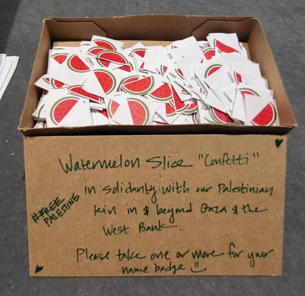 A small gesture, but an invitation to  #ASHE2023 attendees for collective solidarity w/ Palestinian/Gaza/West Bank kin: If interested, there are mini watermelon slices available to pick up & insert in your name badges (next to the masks on the 3rd floor near registration set up).