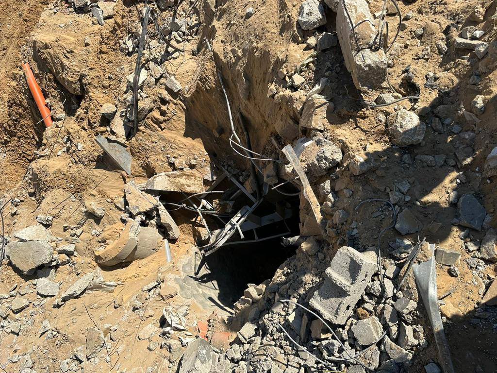 sentdefender's tweet photo. A Significant Stockpile of Weapons and Munitions were Discovered in Tunnels beneath the Al-Shifa Medical Complex today, following a Large-Scale Excavation in the Courtyard of the Hospital which began last night; these Excavations will continue within the Complex as additional Tunnels and Underground-Bases used by Hamas are Found.