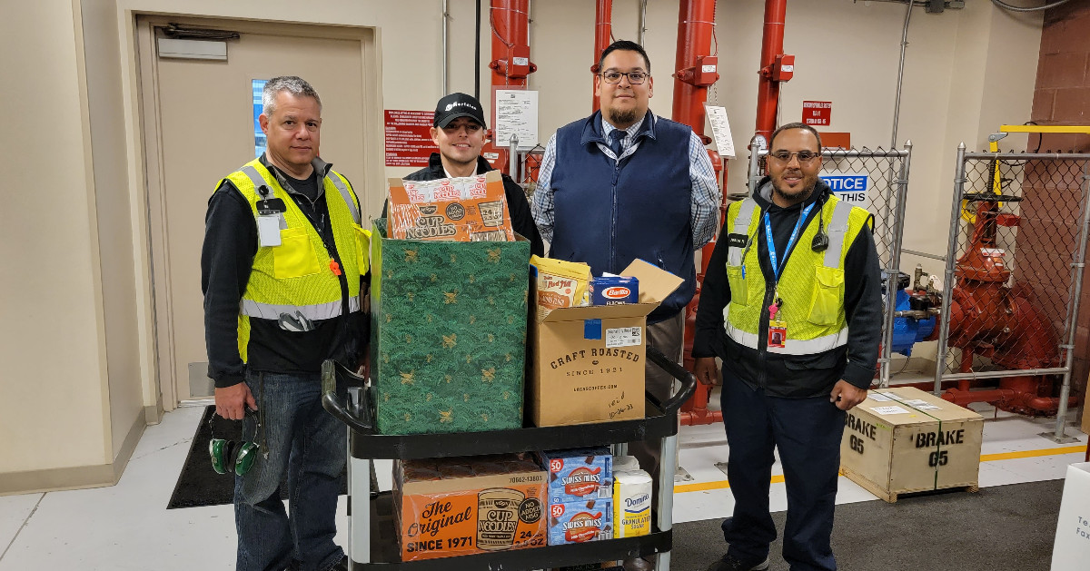 Team members proudly display a cart filled with donations by Meridian employees before being picked up by Eva's Village as part of their annual food drive. The shelter is located in Paterson, NJ, and serves an average of 1,000 meals daily. 

#EvasVillage #Giving #HelpingOthers