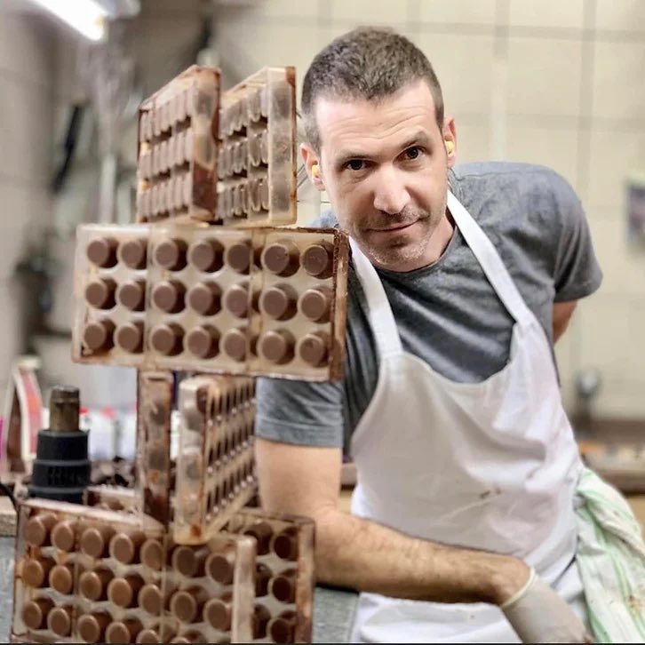 “Dad has been murdered. So has Stav. Help.”

Dvir, a chocolatier from Kibbutz Reim. When Hamas terrorists infiltrated the kibbutz on 10/7, he hid with his partner Stav and two children. The terrorists reached their home and Dvir tried to protect his family with an axe, but was