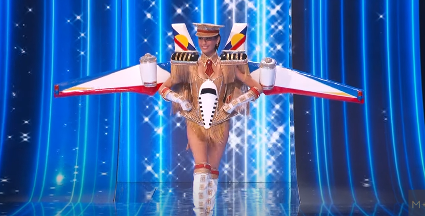 PhilstarNews's tweet photo. SALUTE TO SERGEANT MICHELLE MARQUEZ DEE 🫡✈️

Miss Universe Philippines Michelle Dee mesmerizes the universe as she struts across the #MissUniverse2023 stage for the national costume competition, wearing an outfit that represents a plane and a captain’s hat, showcasing the gems of the Philippines.

“Rising from her back, wings bear the colors of the Philippine flag and a mural of it’s most breathtaking sights while parading the country’s official tourism slogan: #LoveThePhilippines. Crowned with a captain’s hat, this is a salute to her role as an Air Force reservist and to our boundless adventures awaiting in the skies,” reads a post on Dee’s Instagram page.

📸 Miss Universe/Youtube, Michelle Dee | via John Marwin Elao