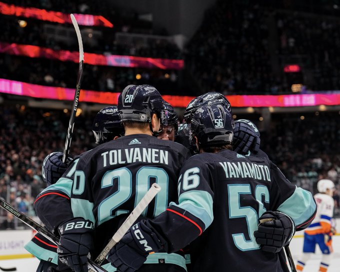 kraken players celebrating a goal