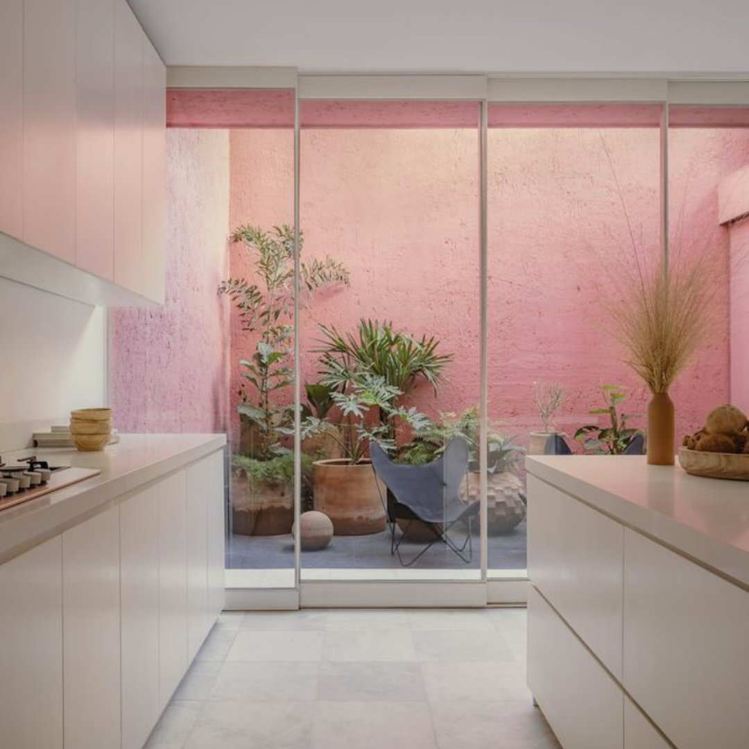 Mexican architects César Béjar Studio have placed a minimalist pink house between two buildings in Culiacán, Mexico, while bringing light into its centre via atriums and voids. #PinkFriday