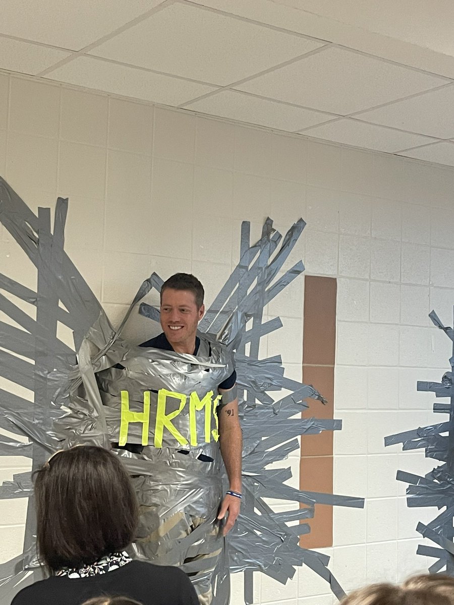 Because we met our goal in coin wars, Mr. Daniel and Mr. Cole were duct taped to the wall as a reward! Now… on to the pep rally, silly stringings, and pies in the face!