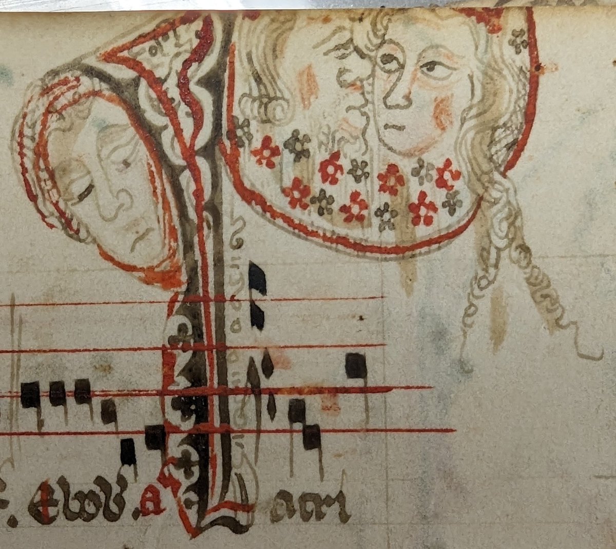 Two lovers gazing at each other while a jilted suitor sulks off to the side? Illustration in the top margin of a 14th-century antiphonal fragment in a private collection in Ohio. #MedievalManuscripts ##ManuscriptFragments #CourtlyLove #Romance