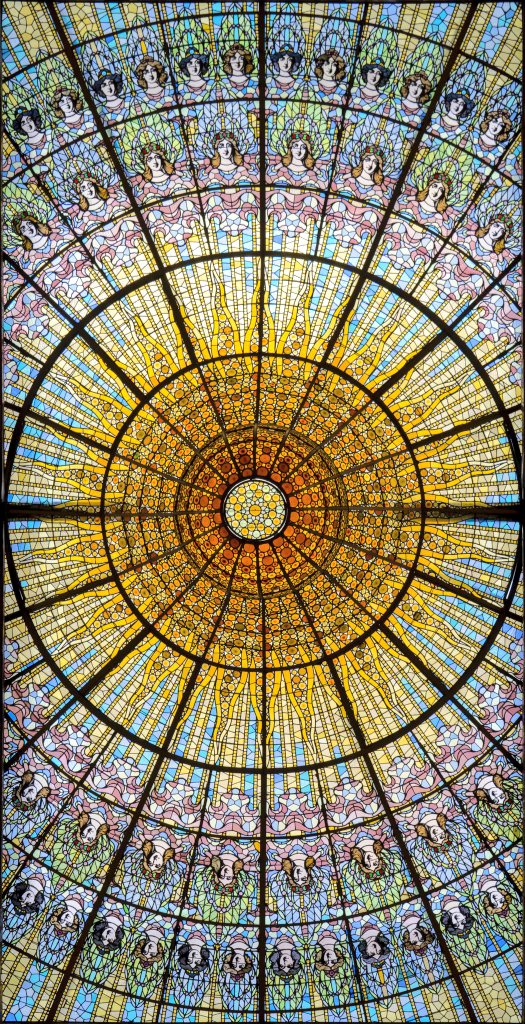 Art Nouveau stained glass dome from 1908 at the Palace of Catalan Music, a concert hall in Barcelona, designed by painter and glassmaker Antoni Rigalt (1850-1914).