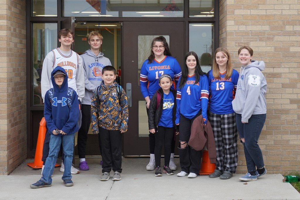 Members of the Varsity Club greeted students at parent drop-off this morning to promote athletics and spread some cheer!