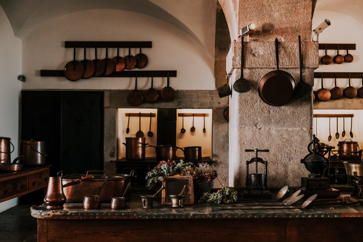 A rustic kitchen with copper pots, a stone pillar, and a cozy atmosphere. #RusticKitchen #InteriorDesign #Rustic #Design 🍳🏡📸

Photo by Oleksandr Kurchev
