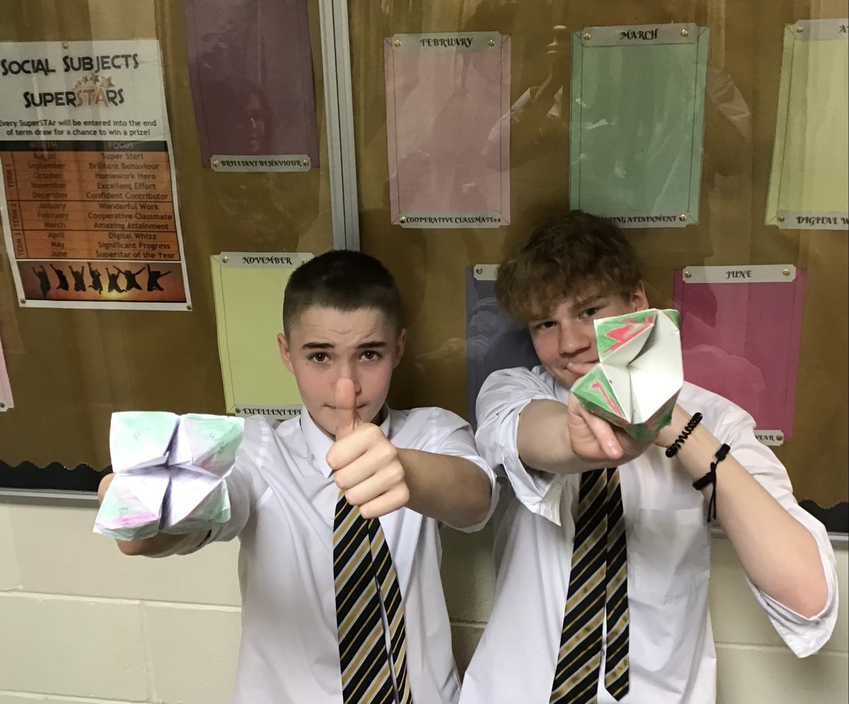 STASocSub's tweet photo. Mark and Nicholas from @STA_S2 2A showing off their origami skills to make fortune teller volcanoes. Instead of fortunes, they uncover a topical question that the other has to try to answer correctly. https://t.co/6Lu5TZkVkn