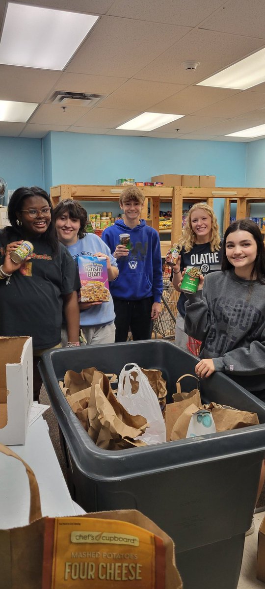 MaBlackOW's tweet photo. West students working hard at the Salvation Army - organizing food, toiletries, and setting up for the holidays! #OWGiveAHoot @OWNovacekOWLS @olatheschools @OWNovacekOWLS https://t.co/lyrqlhVYKR