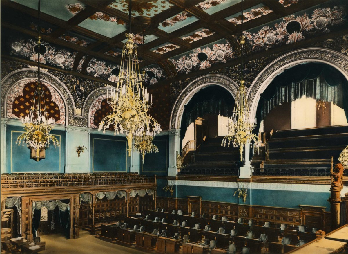 #FBF - The four original gasoliers in the Legislative Chamber each weigh close to 1000 pounds and must be lowered on pulleys to change the lightbulbs. See here the original light fixtures circa 1893