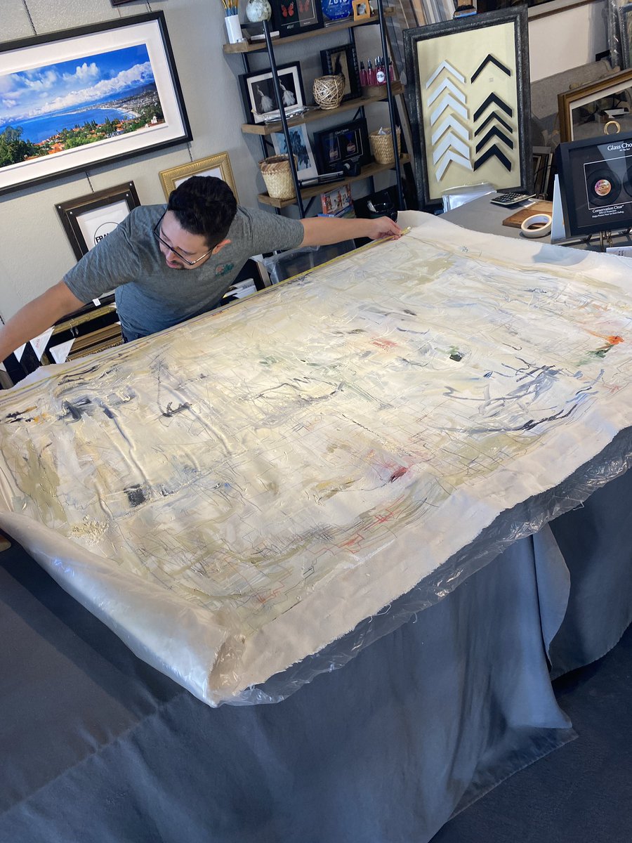 Time to stretch 🖼️ Local framer measuring this massive piece up