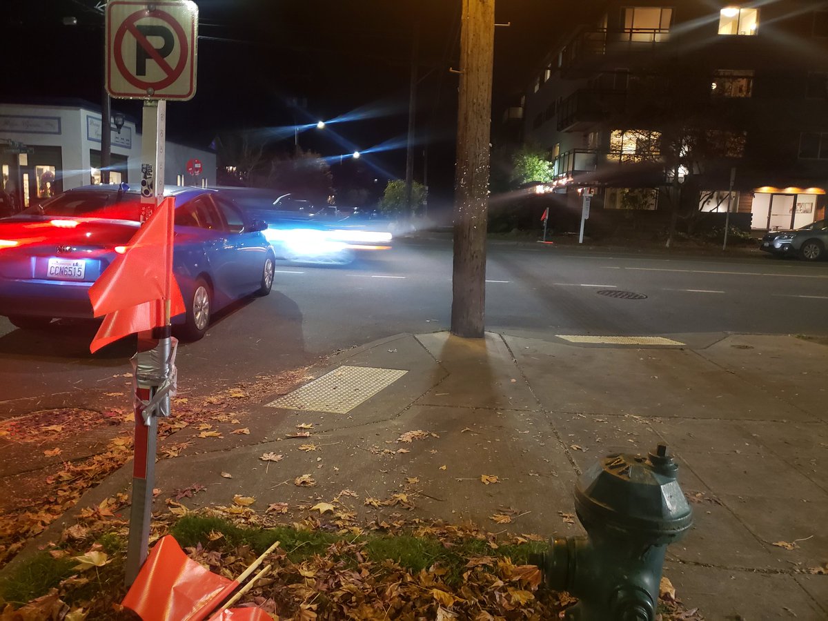 This is immediately outside of my work. In August an elderly woman was hospitalized after being ran over trying to cross the street just a block north of here. In response these flags were put in. Surprising nobody, they simply do not help.