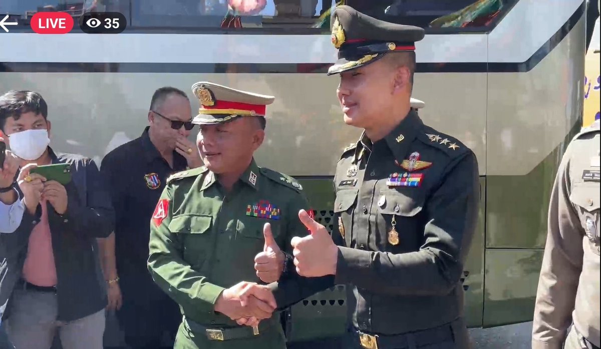 Oh the irony.
Thai police shaking hands and photo ops with the junta official whos actually responsible for the taking them as hostages. 😂