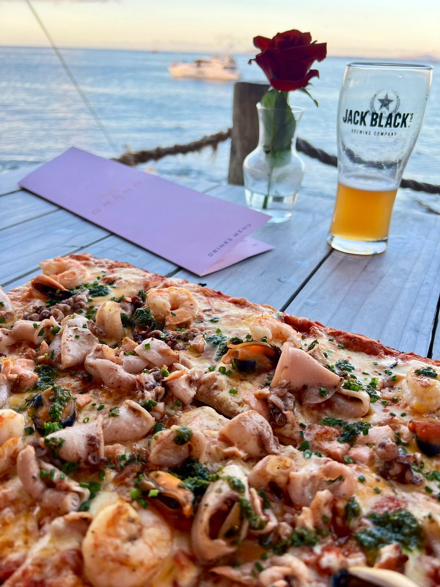 Edelweiss_Delp's tweet photo. Undoubtedly the best seafood pizza is served at The Grand Café &amp;Beach in Granger Bay, V&amp;A Waterfront Cape Town. Sitting at the waters edge with a cocktail in hand admiring the playful dolphins! #GrandAfricaCollection #travel #SouthAfrica #CapeTown #TheGrand #pizza #jackblack #sea https://t.co/FfrDC8JrK9