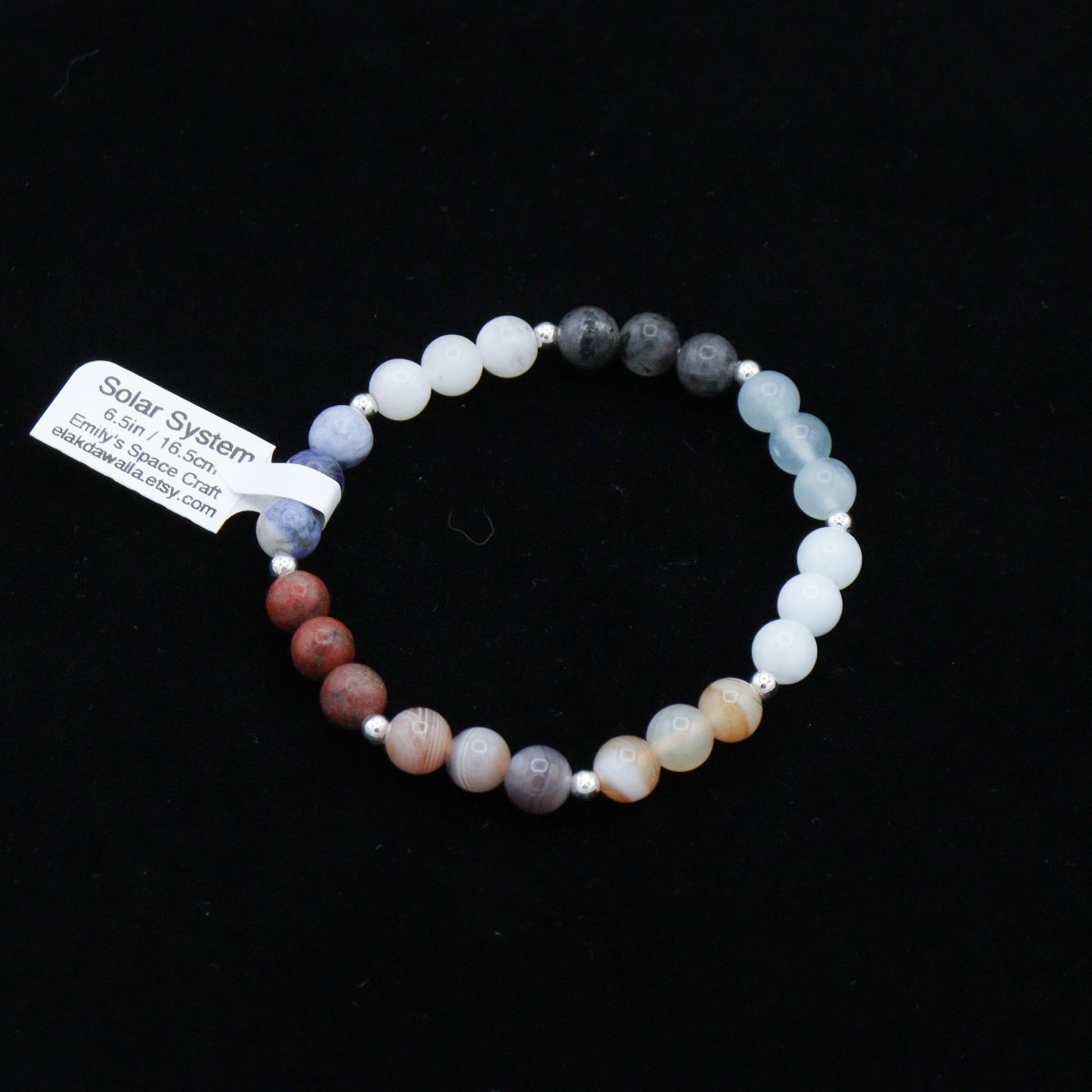 Newly listed! Solar system "chakra" bracelets. Gemstone beads representing the 8 planets strung on elastic cords. These bracelets fit snugly and warm up with body heat -- it feels great to wear them! elakdawalla.etsy.com/listing/159983…