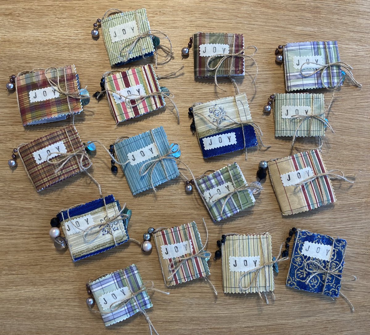 MrsBezoari's tweet photo. Taken me hours but they are ready. 😮‍💨 Each child in my class will receive an Advent ‘Journal of Joy’. Filled with pockets, envelopes, cards &amp; mini journals. Made from scratch incl. paper dyeing, stencilling, sewing &amp; charm. Aim to reflect &amp; write in it daily &amp; Xmas Eve hang on 🎄 https://t.co/v9zjnK7vYn