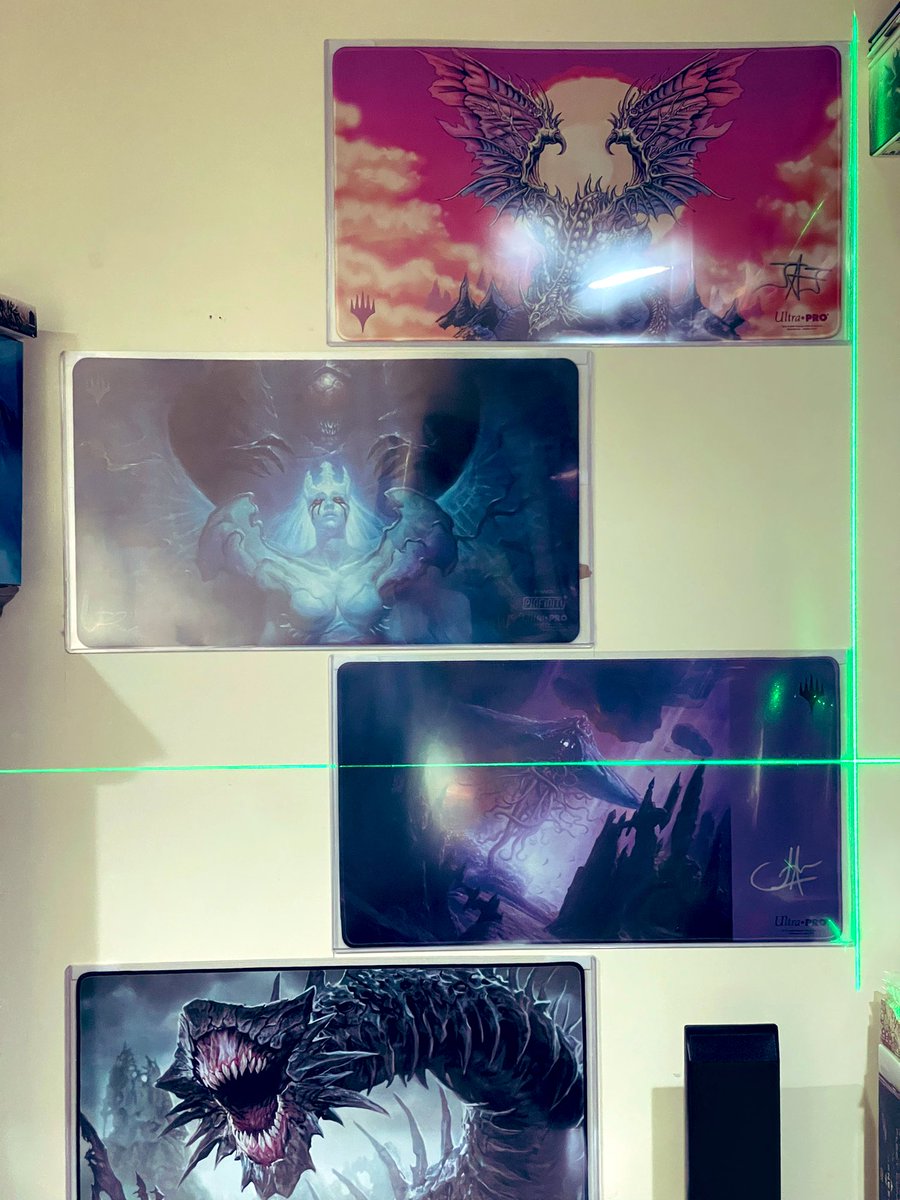 Ignore the glare, but redid the wall to add one more @UltraProIntl playmat top-loaders for the win Top to Bottom: 1️⃣Ur Dragon by @TeanWitch 2️⃣Enslave by @ChrisRahnArt from the @PinfinityAR draft 3️⃣Emrakul by @JohnAvonArt 4️⃣That damned smile by @JasonChanArt