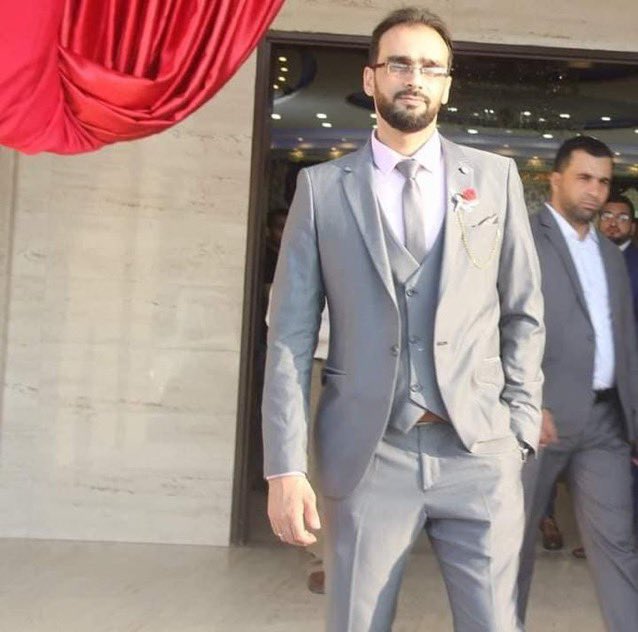 GazaMartyrs's tweet photo. The martyr Ali Al-Naouq, 33 years old, held a doctorate and was a lecturer at one of the universities in Gaza. He was a friend to his students, beloved by everyone, known for his noble character and kind heart. He was martyred in an Israeli bombardment on his family's home along with many of his cousins and siblings in November 2023. 
His young daughter, Shaimaa, two years old, was also martyred in an Israeli bombardment on their home with her mother a few days after Ali's martyrdom.