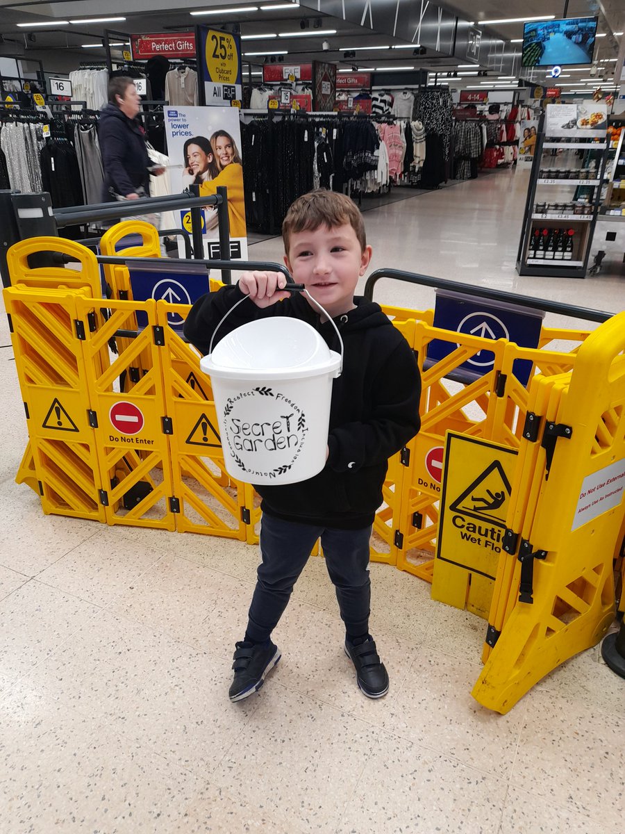 Bellesmummy10's tweet photo. George spent the morning collecting money for Secret Garden at @Tesco.  He used lovely manners and had a big smile for everyone. He raised £88 in his bucket. Well done George @misssburns @StJosephStBede https://t.co/LdRGDt68UH
