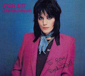 NFT_Dee's tweet photo. In anticipation of @ToolsOfRockNFT Vol2 - The 80’s, I’m going to be dropping some 80’s music history over the next few weeks 🤘🏼

————————————-

The early 80’s carried over some of the 70’s hard rock vibes of bands like Led Zepplin and Black Sabbath. 𝐉𝐨𝐚𝐧 𝐉𝐞𝐭𝐭 was there to keep the female empowerment rolling with her second album 𝐼 𝐿𝑜𝑣𝑒 𝑅𝑜𝑐𝑘 ‘𝑛’ 𝑅𝑜𝑙𝑙, released on this day in 1981. 

Joan Jett started her career in the late 70s in a teen all-female band named The Runaways.  The runaways featured Jett, Cherie Currie and Lita Ford. 

Jett struck out on a solo career with the album and lead single 𝐵𝑎𝑑 𝑅𝑒𝑝𝑢𝑡𝑎𝑡𝑖𝑜𝑛 released at the beginning of 1981.  For her second album though, she added the backing band The Blackhearts.  

𝐼 𝐿𝑜𝑣𝑒 𝑅𝑜𝑐𝑘 ‘𝑛’ 𝑅𝑜𝑙𝑙 the album went to #2 on the Billboard charts and the song spent 7 weeks on top of the Billboard singles chart in 1982.  The album also produced a lesser hit, 𝐶𝑟𝑖𝑚𝑠𝑜𝑛 𝑎𝑛𝑑 𝐶𝑙𝑜𝑣𝑒𝑟, the cover of a Tommy James & the Shondells’ tune. 

I was ??,??? days old (today) when I found out that 𝐼 𝐿𝑜𝑣𝑒 𝑅𝑜𝑐𝑘 ‘𝑛’ 𝑅𝑜𝑙𝑙, the song, is also a cover.  Originally written/recorded by the British band Arrow in 1975, Jett and her then Runaways bandmates saw the song on TV during a 1977 tour in England. They almost immediately began working it into their sets. 

Jett originally recorded the song in 1979 with 2 members of the Sex Pistols.  It was included as the B-side to a single that never got any traction.  So she recorded it again when she teamed up with the Blackhearts in 1981.  This time it was a hit. 

Jett’s version of the song is the most recognized version and has received critical acclaim and awards. Joan Jett was inducted into the Rock ‘n’ Roll Hall of Fame in 2015 and the song itself was inducted in 2016. 

MTV played a big part in the single’s success as well.  The video was originally shot in color, but when Jett watched it back, she was horrified by her red leather outfit against the red/mauve heavy color composition of the rest of the set.  A black and white shot from the video caught her eye and the full video was switched to black and white. The retro B&W vibe  made the song and video standout amongst the flamboyantly colored videos on MTV at the time. 

Finally, I can’t in good conscience end this without mentioning one of the remakes of 𝐼 𝐿𝑜𝑣𝑒 𝑅𝑜𝑐𝑘 ‘𝑛’ 𝑅𝑜𝑙𝑙.  Weird Al Yankovic had fun with the song and video in one of his most famous parodies, 𝐼 𝐿𝑜𝑣𝑒 𝑅𝑜𝑐𝑘𝑦 𝑅𝑜𝑎𝑑. 

Keep on Rockin’ @joanjett !! 🎸🤘🏼

Ps. If you want to see Joan Jett in concert, she is touring next summer with Alanis Morrisette.  Tickets went on sale yesterday. I saw her a few years ago and she can still kick some a$$.