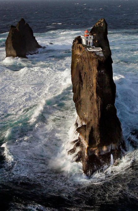 There's a lighthouse in Iceland that sits on the highest of three rocks six miles off the Icelandic coastline, built in 1939 on top of an extremely steep and dangerous rocky cliff. It's the the Þrídrangar lighthouse