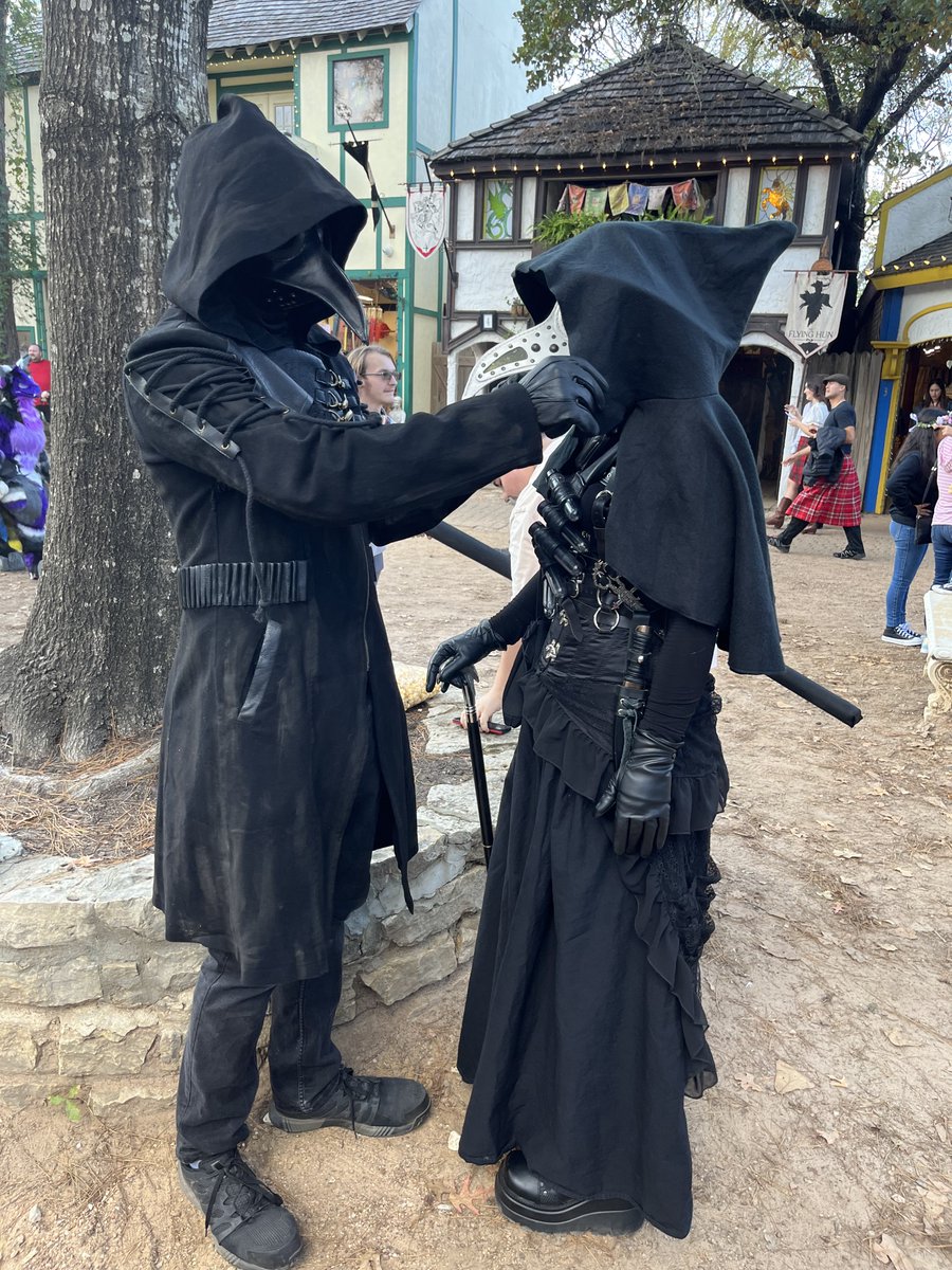 miserycor's tweet image. What if we were plague doctors fixing each others cloaks at the renfaire