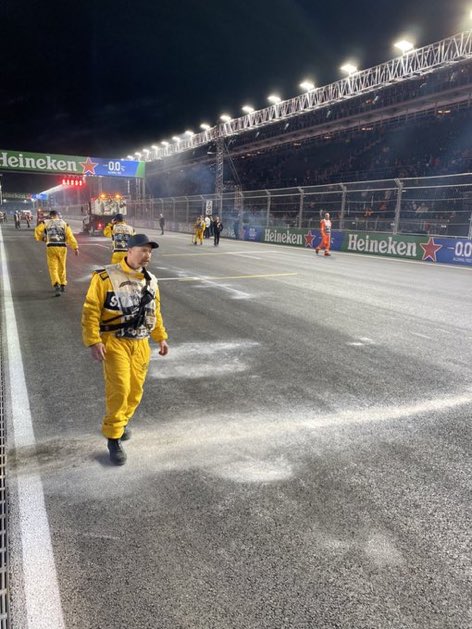 FastestPitStop's tweet photo. Lewis Hamilton, Oscar Piastri and Charles Leclerc’s Parade cars have broken down and leaked a lot of oil on the track.

This could be a disadvantage for those starting on the left side of the track, most notably Max Verstappen.

[picture: @tgruener]

#F1 #LasVegasGP https://t.co/r2Mh5xRd0D
