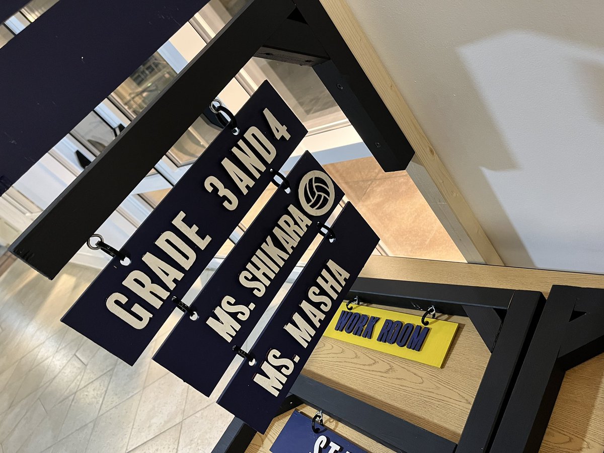luke_james_86's tweet photo. G2 finishing up teacher room signs. They designed in @AdobeExpress, cut out on the @glowforge, painted letters and rectangles, cut and assembled the L brackets, and glued on the letters. It's been a fun project with lots of new skills learned! #makered #thisisdais #issedu https://t.co/NiEWx9qbQB
