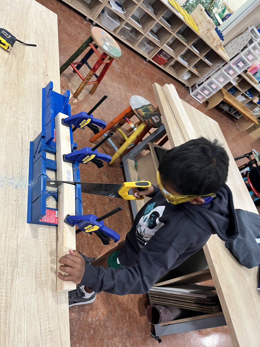 luke_james_86's tweet photo. G2 finishing up teacher room signs. They designed in @AdobeExpress, cut out on the @glowforge, painted letters and rectangles, cut and assembled the L brackets, and glued on the letters. It's been a fun project with lots of new skills learned! #makered #thisisdais #issedu https://t.co/NiEWx9qbQB