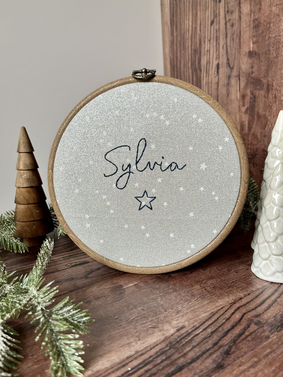 Say hello to some Sunday Christmas sparkle 🌟 

Another new gorgeous name hoop available on grey star glitter fabric 🤩 entirely hand stitched and made to order. 

Available from my Etsy store - 
theflossystitch.etsy.com