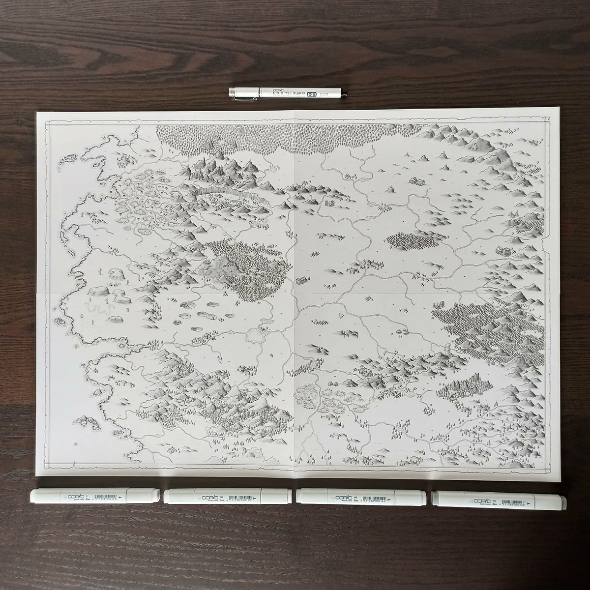 jogbrogzin's tweet photo. Just finished inking a poster (A2) size map for a new book by @SethRing. I used copic multiliners for ink and copic markers for mountain shading.

I'm handing it off to my daughter for colour now.

#fantasymap #litrpg #worldmap #worldbuilding #dndmap #rpgmap #ttrpg #handdrawnmap https://t.co/qxo4WErr7w