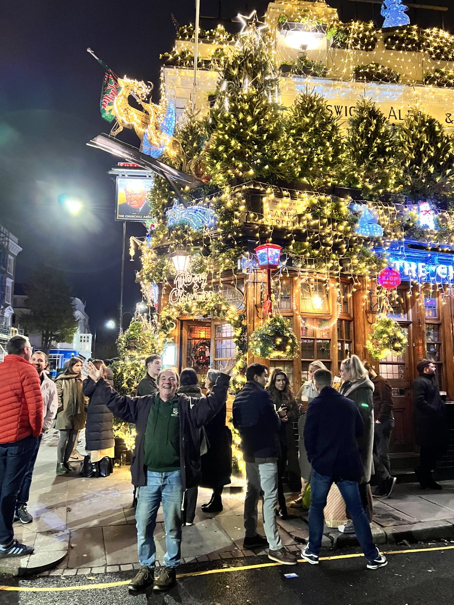 Apparently Christmas is coming! Dr M amidst abundant Christmas lighting all over and above the Churchill Arms, Kensington @ChurchillArmsW8